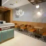 Modern restaurant interior design in Kuwait with elegant seating and ambient lighting