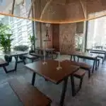 Chic dining space featuring modern furniture and statement lighting